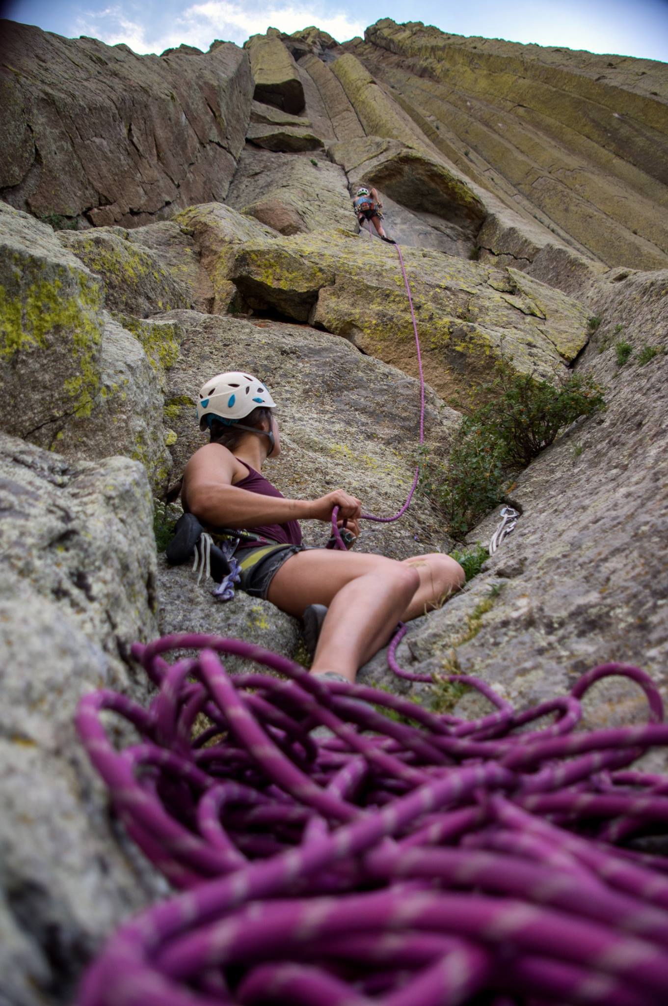 Belayer gazing up at climber